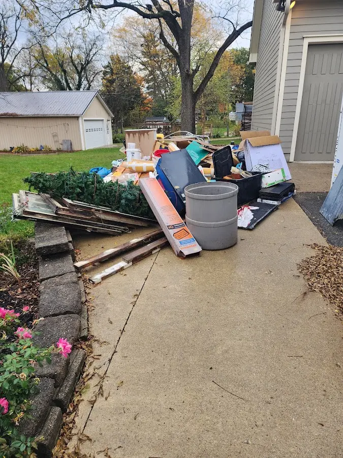 Dumpster being loaded with debris for Demolition Dumpster Rental in North Yarmouth
